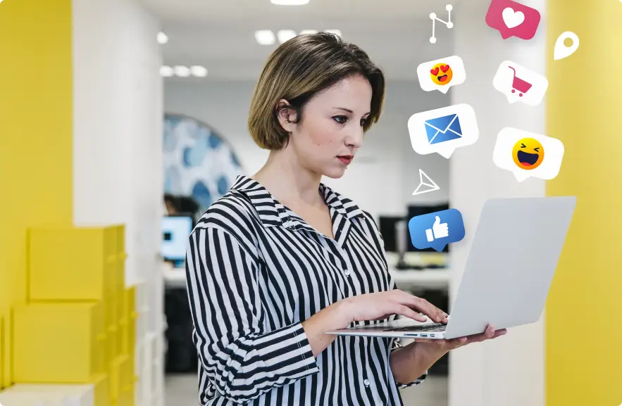 A woman working on a laptop with social media icons floating around, highlighting the diverse social media marketing services offered by Techpullers.