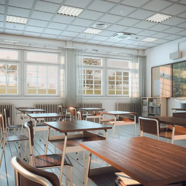 Empty classroom with desks and chairs, illustrating TechPullers' creation of a dynamic online presence for IFCB Business School to attract students and build a road to success.