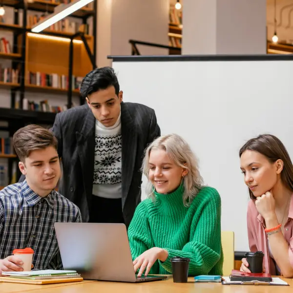 Team members collaborating in an office, representing TechPullers' web design for Skillcert Consultancy, enhancing user engagement and course accessibility for professional certification courses.