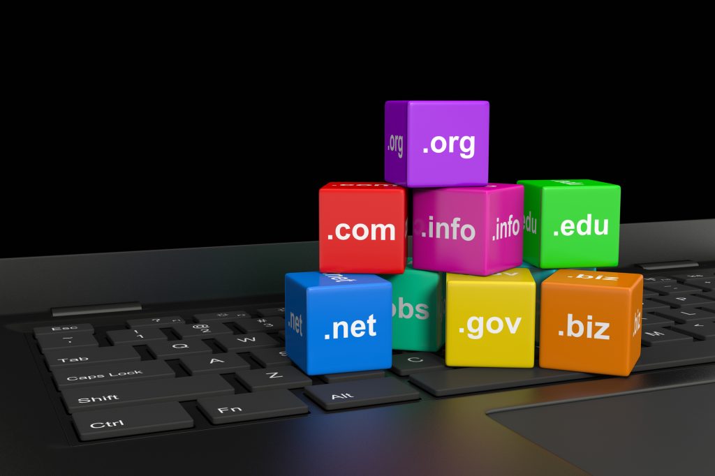Internet Domain Names Cubes on a Laptop Computer Keyboard 3D Illustration