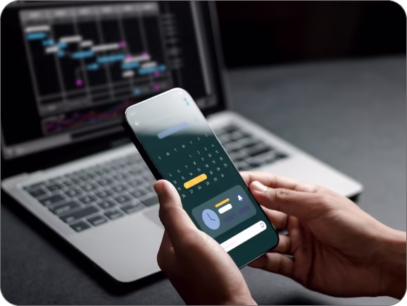 Mobile app development services by Techpullers - person using smartphone with analytics dashboard and UI designs, showcasing Android and iOS app solutions.