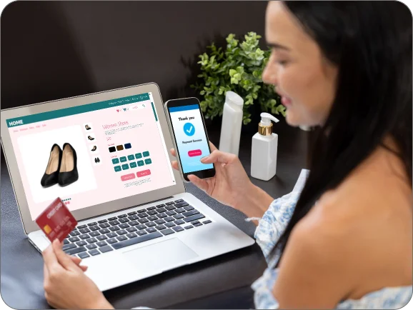 Ecommerce development services by Techpullers - woman shopping online using laptop and mobile with secure payment checkout, showcasing Shopify, WooCommerce, and Magento solutions.